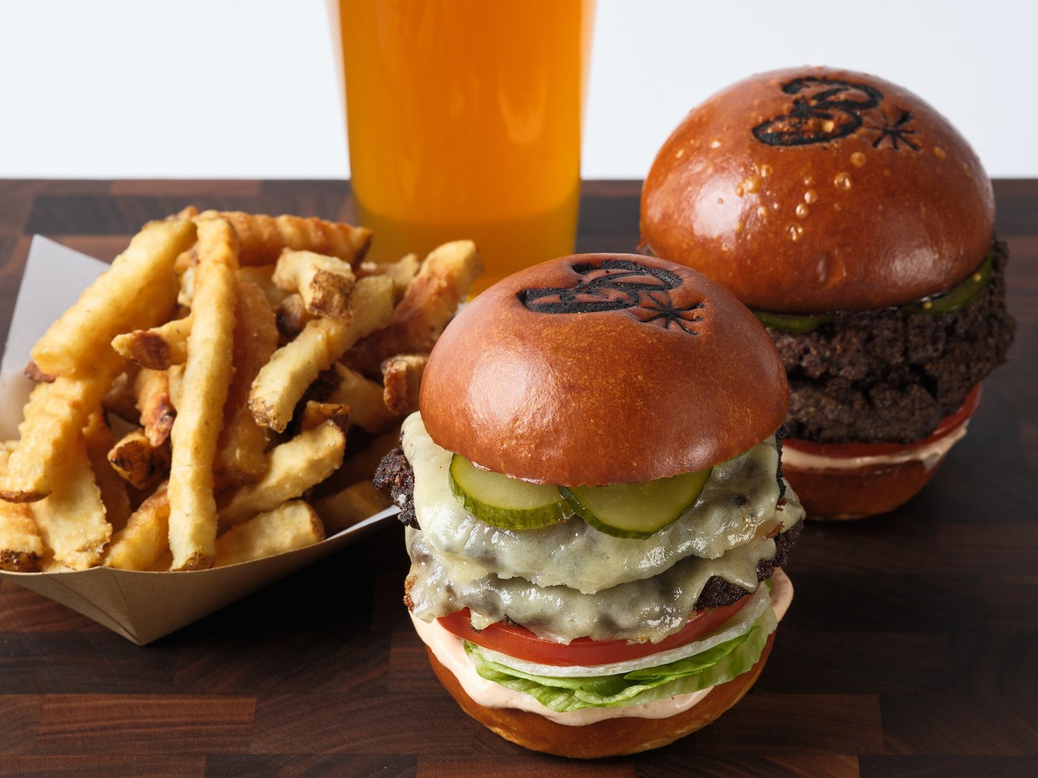 Burgers, crinkle-cut fries and a beer at Burgers & Half Bottles.