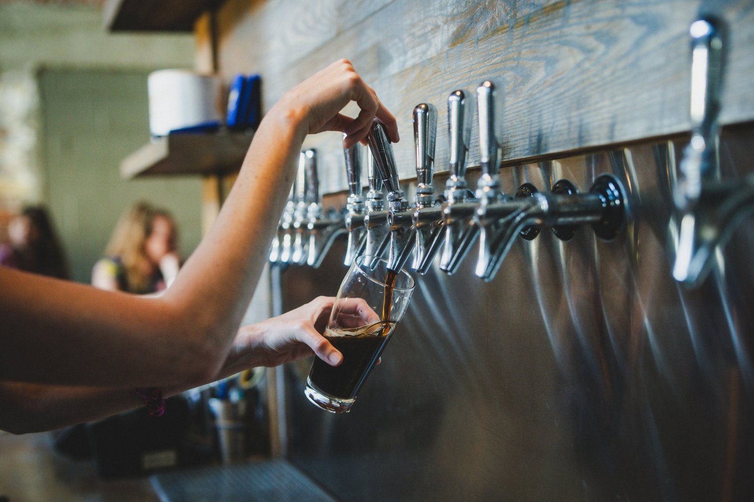 A beer being poured from the taps at Enterprise Brewing Co.