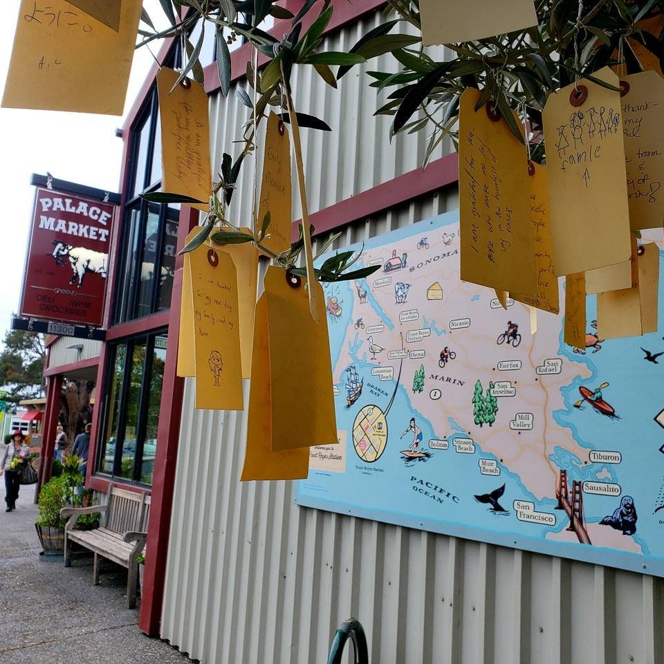 The Palace Market storefront and a map of Marin outside the shop.