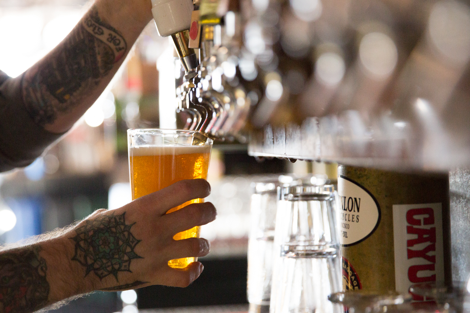 A bartender pouring a draft beer at Zeitgeist.